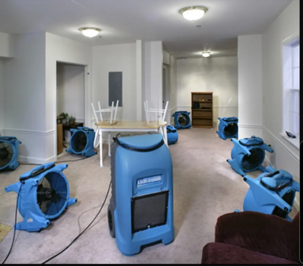 Air movers and dehumidifier setup for Water Damage Restoration in Trinity
